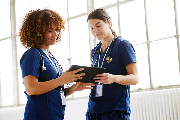 Nursing students using tablet